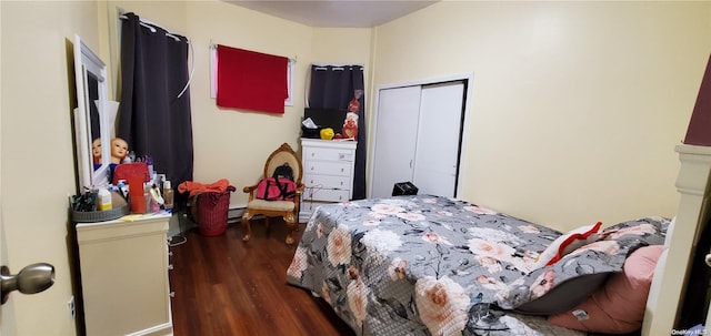 bedroom with a closet and dark hardwood / wood-style floors