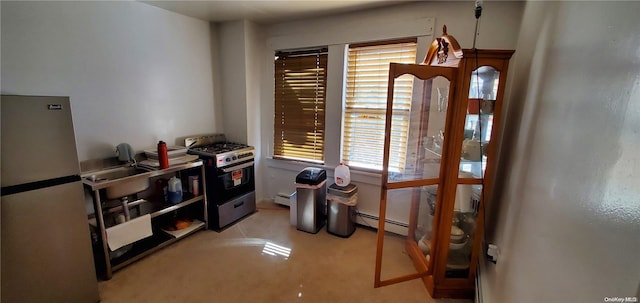 misc room with sink and a baseboard heating unit