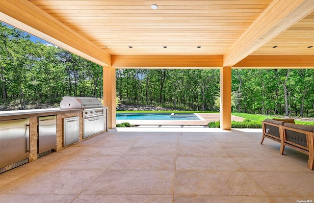 view of patio featuring an outdoor kitchen and area for grilling