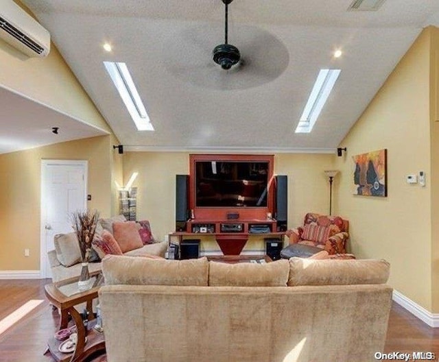 living room with wood-type flooring, a wall unit AC, ceiling fan, and lofted ceiling