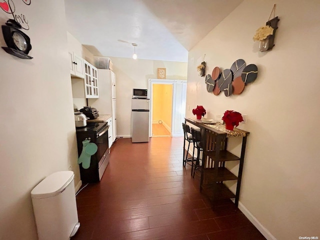 hallway with dark wood-type flooring