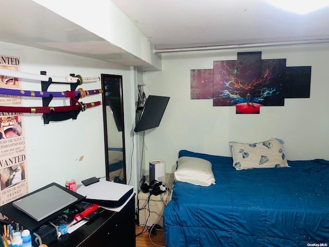 bedroom with wood-type flooring