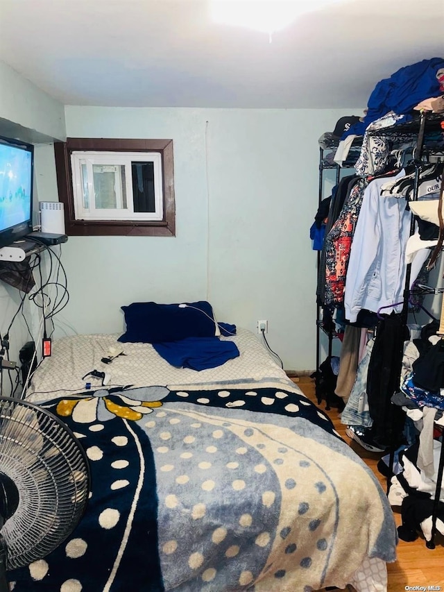 bedroom featuring wood-type flooring