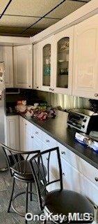 kitchen with white cabinetry and a breakfast bar