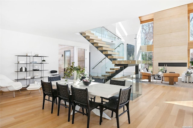 1739 Millstone Rd, Sag Harbor, NY 11963 - dining area featuring wood finished floors and stairs