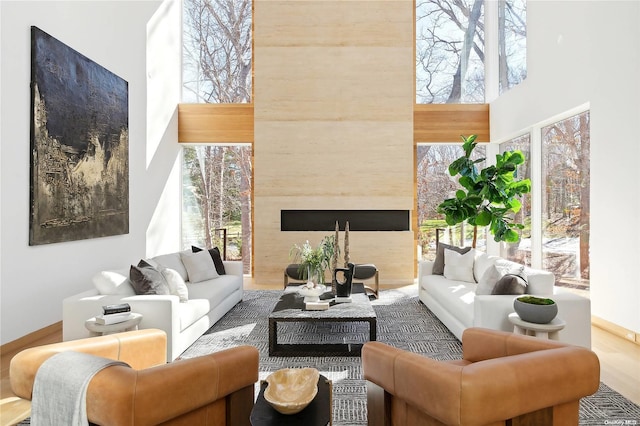 1739 Millstone Rd, Sag Harbor, NY 11963 - living area featuring a premium fireplace and a towering ceiling