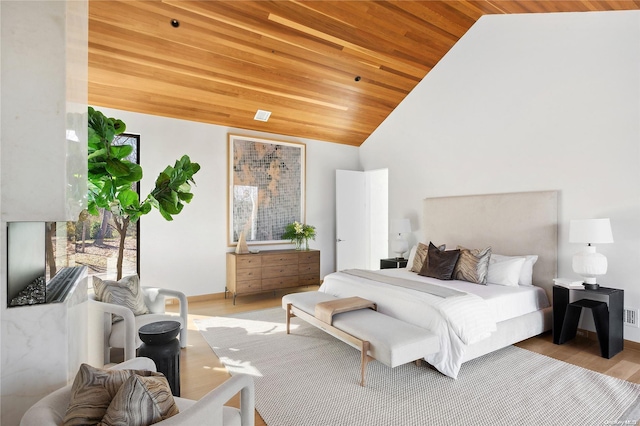 1739 Millstone Rd, Sag Harbor, NY 11963 - bedroom with baseboards, light wood finished floors, high vaulted ceiling, and wood ceiling