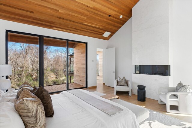 1739 Millstone Rd, Sag Harbor, NY 11963 - bedroom with wood ceiling, wood finished floors, access to exterior, and high vaulted ceiling