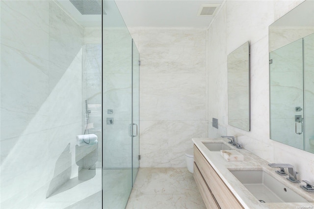 1739 Millstone Rd, Sag Harbor, NY 11963 - bathroom featuring a sink, toilet, a stall shower, and tile walls
