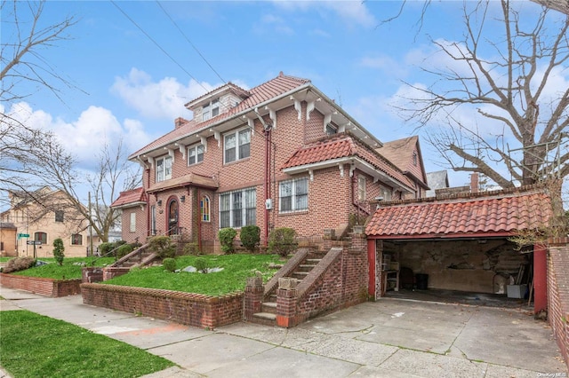 view of front of house with a front yard and a garage