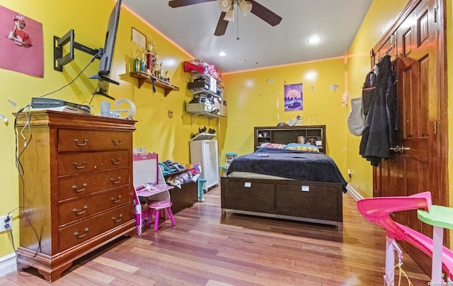 bedroom featuring light hardwood / wood-style floors and ceiling fan