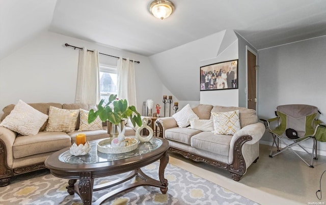 living room featuring carpet flooring and vaulted ceiling