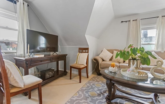 sitting room featuring lofted ceiling