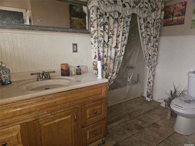 full bathroom featuring vanity, tile patterned flooring, shower / bathtub combination with curtain, and toilet