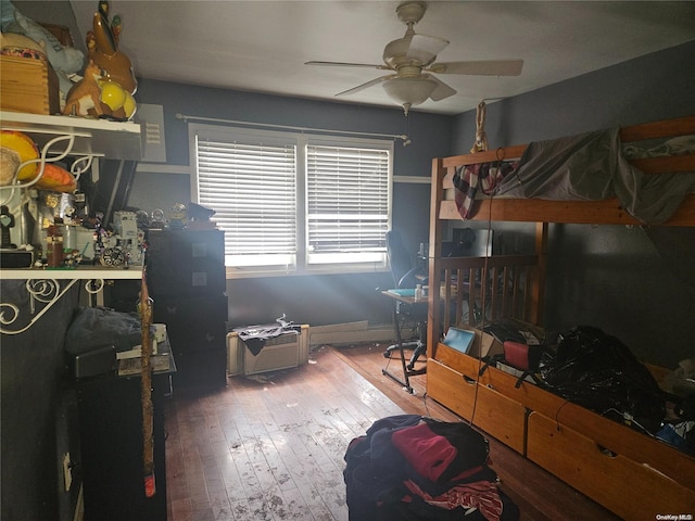 bedroom with hardwood / wood-style floors and ceiling fan