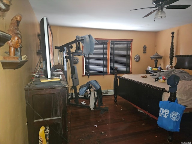 bedroom with ceiling fan, dark wood-type flooring, and a baseboard radiator