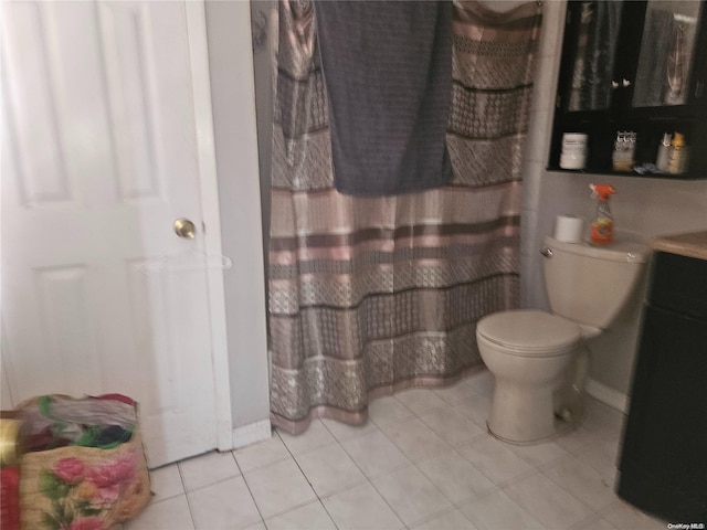 bathroom with tile patterned floors and toilet