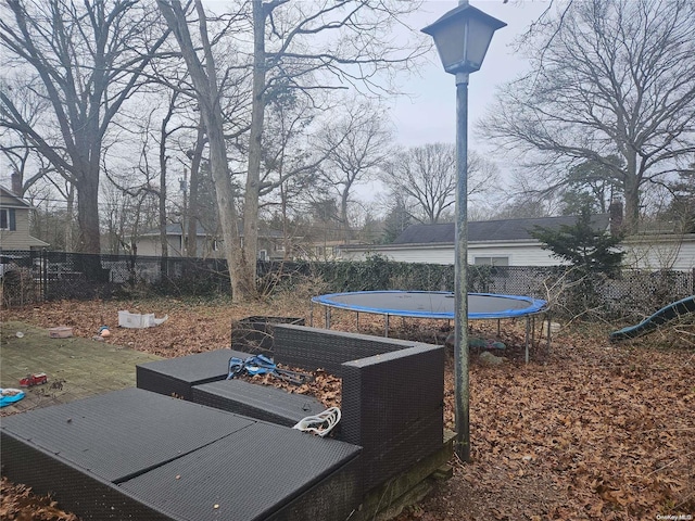 view of yard featuring a trampoline