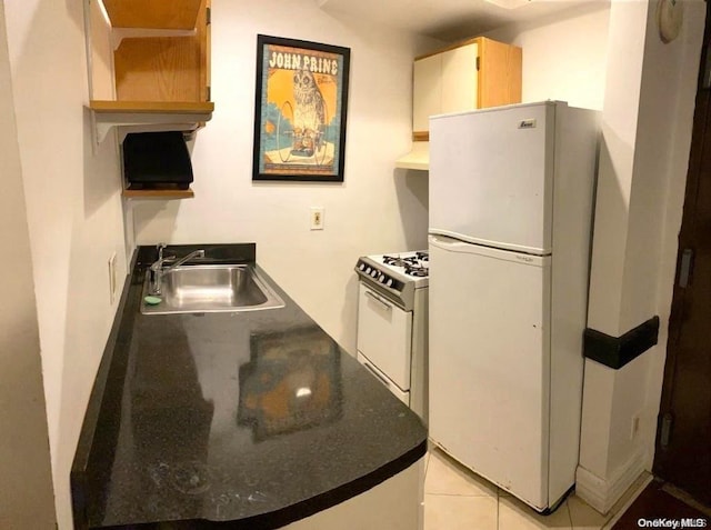 kitchen with range hood, sink, light tile patterned floors, and white appliances