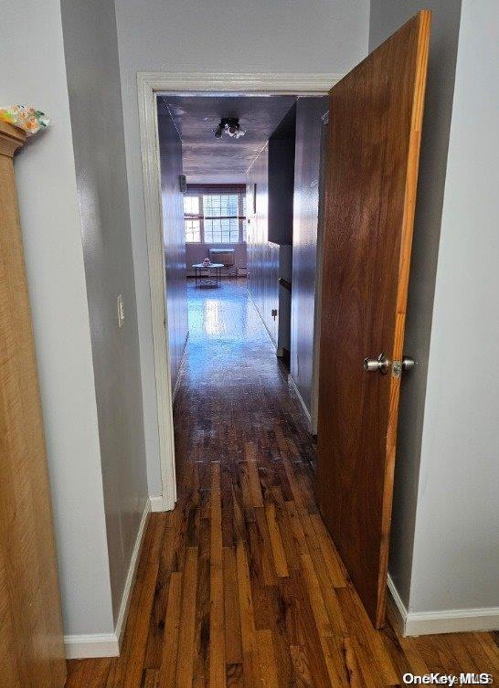 hallway featuring dark hardwood / wood-style floors