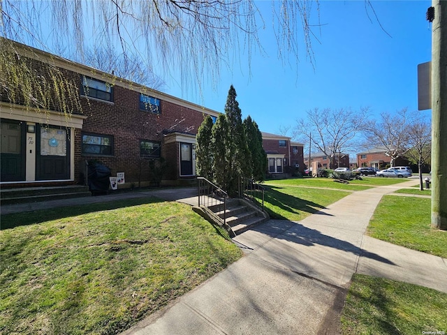 view of property exterior with a yard