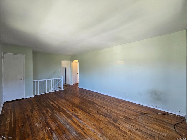 spare room featuring dark hardwood / wood-style flooring