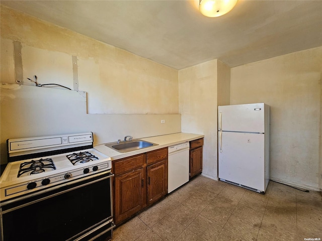 kitchen with white appliances and sink