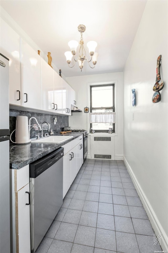 kitchen featuring radiator heating unit, an inviting chandelier, backsplash, white cabinets, and appliances with stainless steel finishes