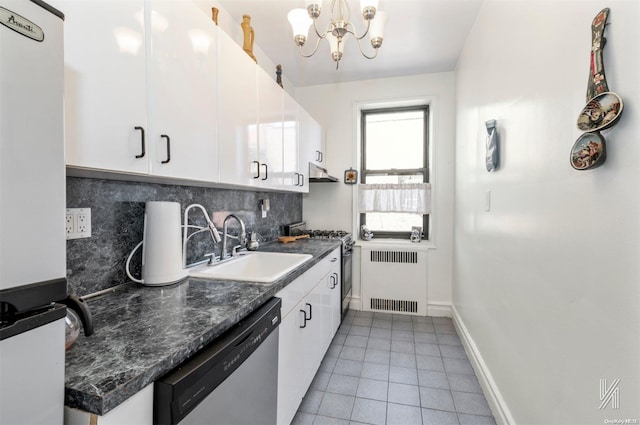 kitchen with sink, decorative backsplash, appliances with stainless steel finishes, white cabinetry, and radiator heating unit