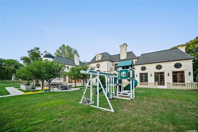 view of playground with a yard