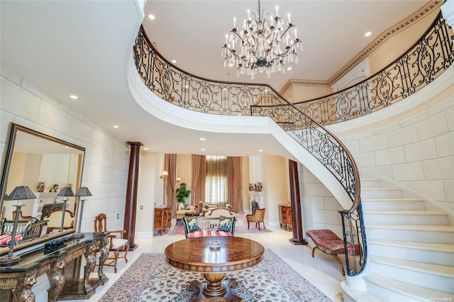 foyer entrance featuring a towering ceiling