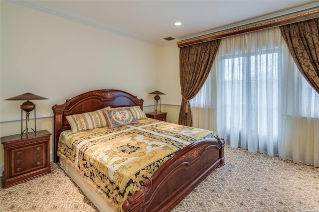 carpeted bedroom featuring ornamental molding