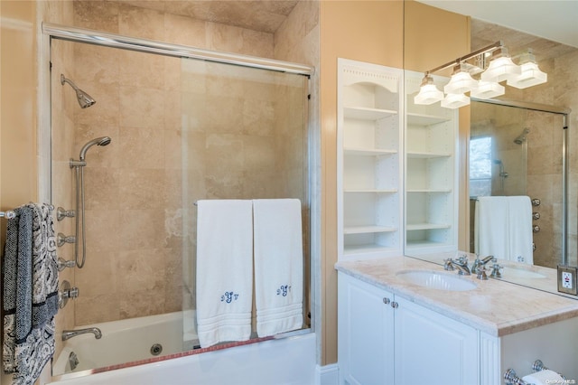 bathroom with vanity and enclosed tub / shower combo