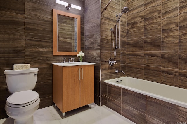 full bathroom featuring vanity, tiled shower / bath combo, and toilet