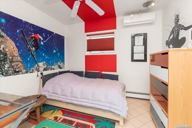 bedroom with ceiling fan, baseboard heating, a wall unit AC, track lighting, and tile patterned floors