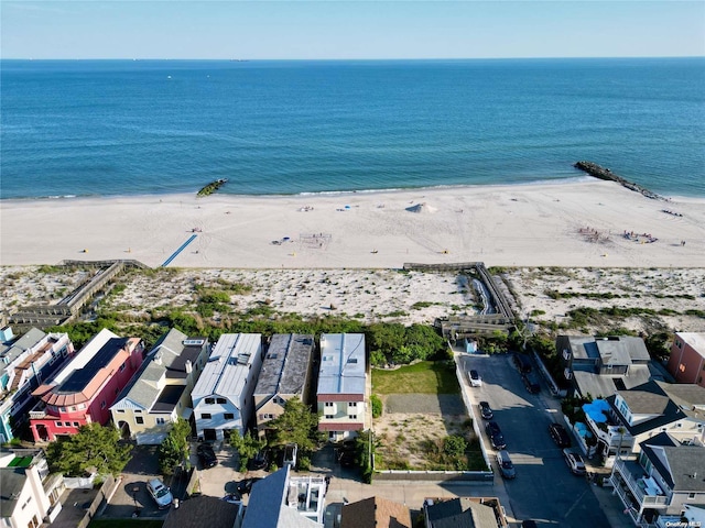 aerial view with a view of the beach and a water view