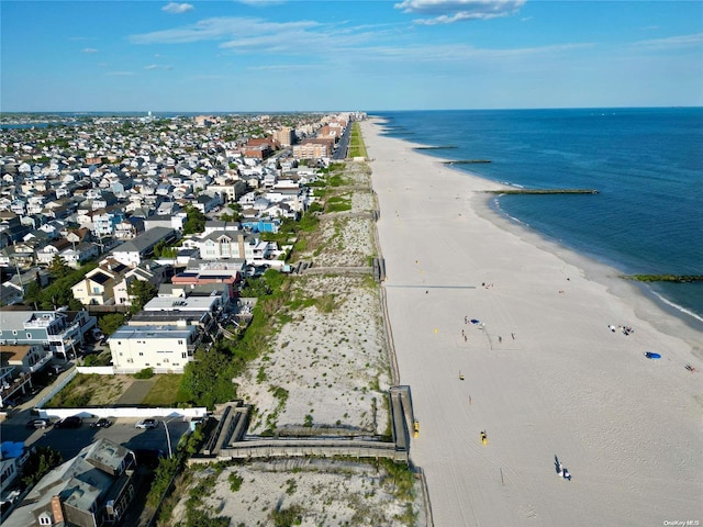 aerial view with a water view and a view of the beach