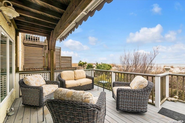 wooden terrace featuring outdoor lounge area