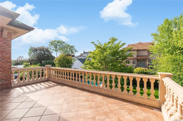 view of patio featuring a balcony