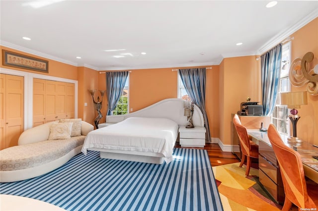 bedroom featuring light wood-type flooring and ornamental molding