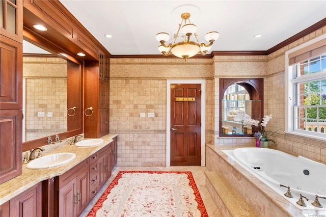 bathroom with tile patterned floors, vanity, crown molding, tiled tub, and tile walls