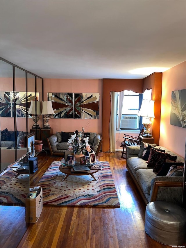 living room featuring cooling unit and wood-type flooring