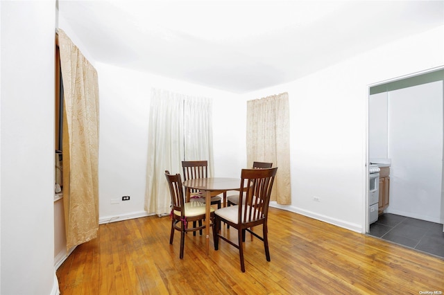 dining area featuring dark wood-type flooring