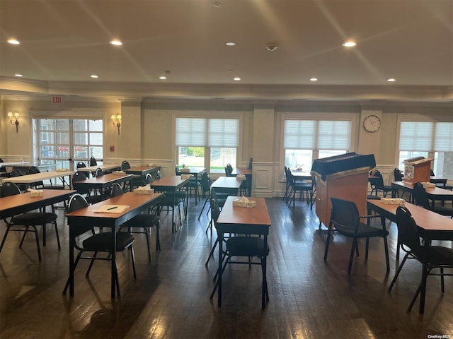 dining room featuring dark hardwood / wood-style flooring and crown molding