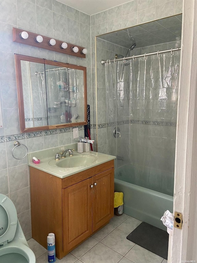 bathroom with vanity, tile patterned flooring, shower / tub combo, and tile walls