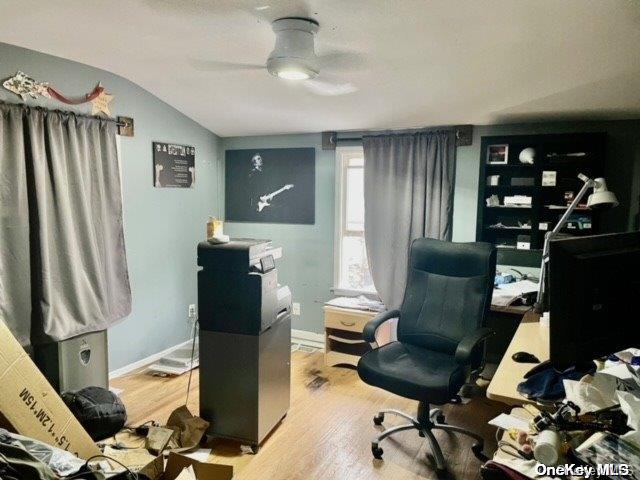 office with ceiling fan, baseboards, wood finished floors, and vaulted ceiling