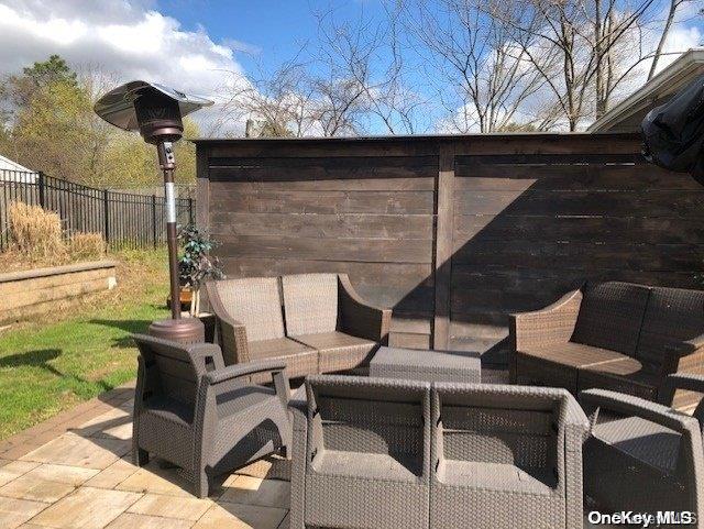 view of patio / terrace with outdoor lounge area and fence