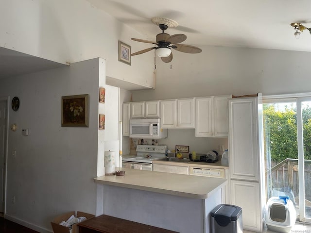 kitchen featuring white appliances, high vaulted ceiling, white cabinets, ceiling fan, and kitchen peninsula