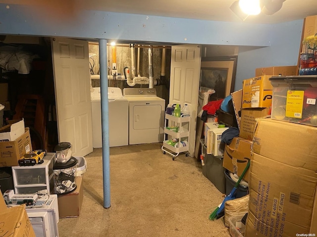 basement featuring light carpet and washing machine and clothes dryer