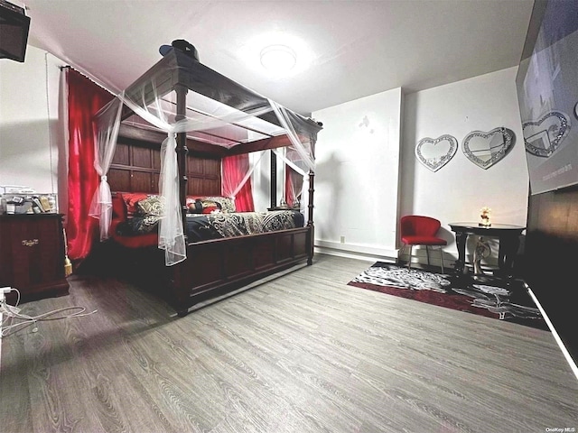 bedroom with hardwood / wood-style floors